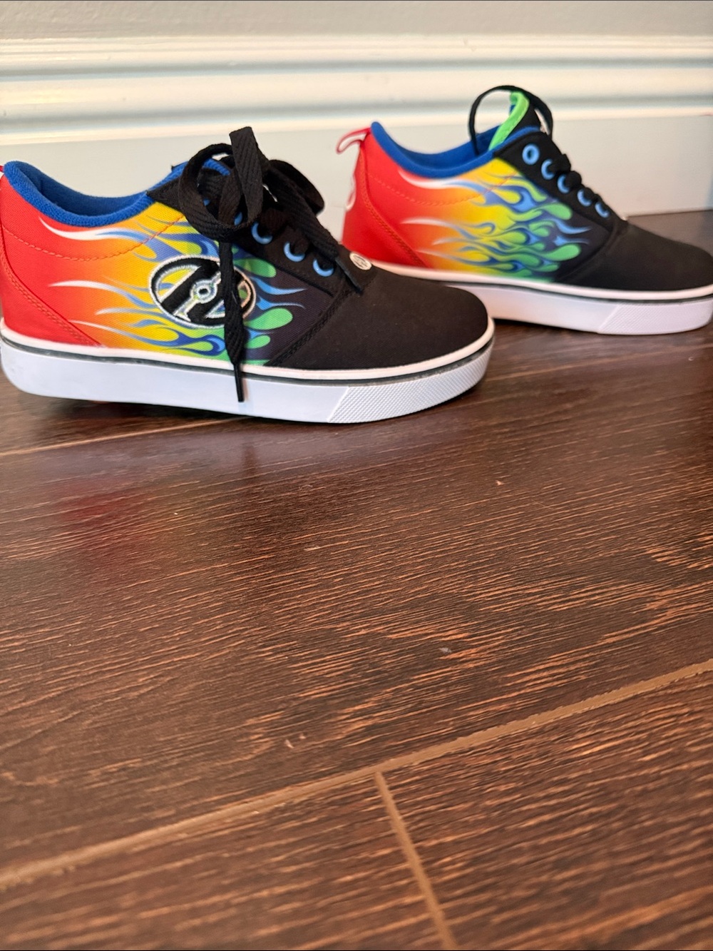 Kids Black Heelys with Rainbow Flame Accent